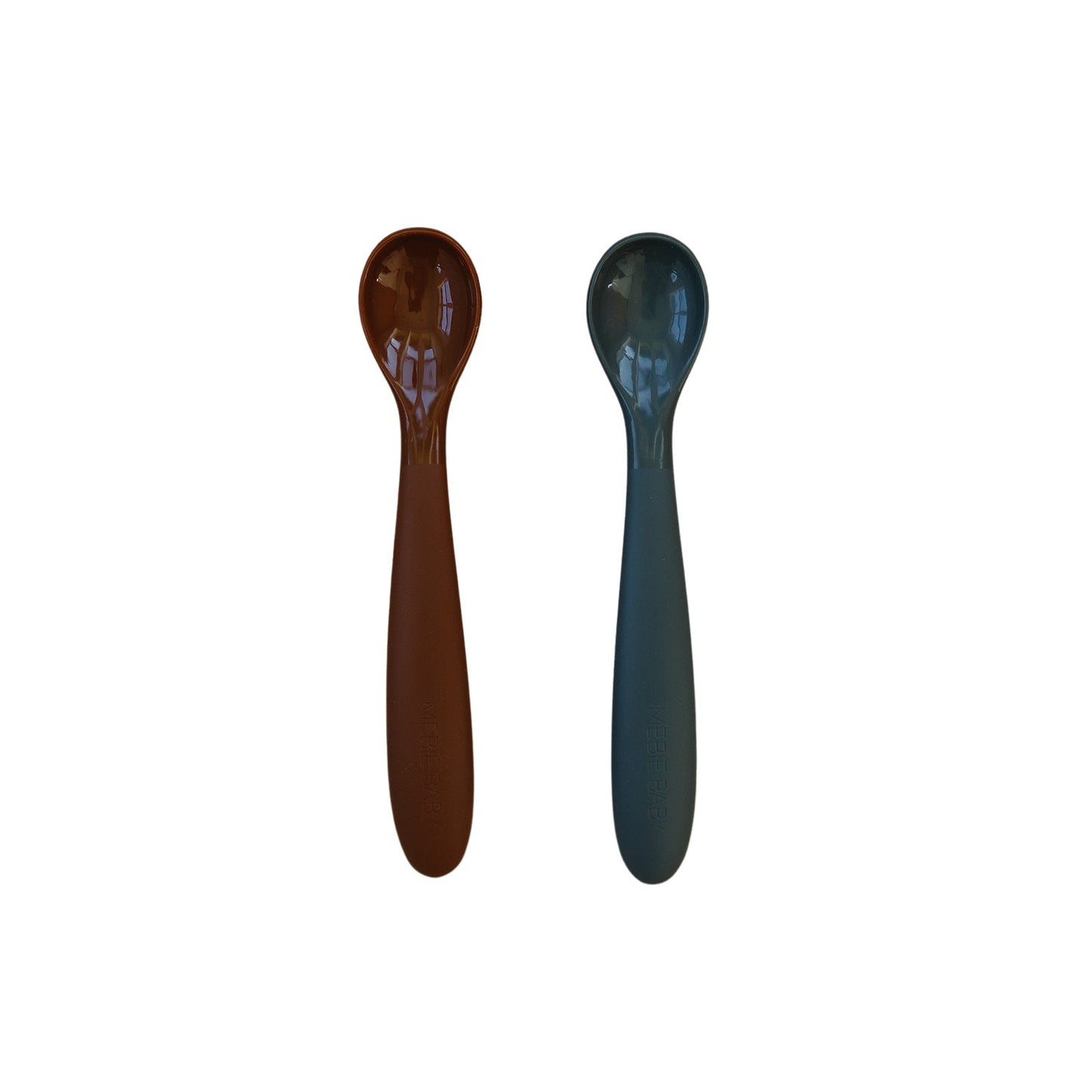 Two wooden spoons, one brown and one blue, on a white background.