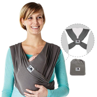 A person wearing a gray Baby K'tan Breeze baby carrier with a charcoal color shade over a teal top