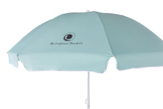 Light blue beach umbrella with 'The California Beach Co.' logo on a white background