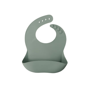 Green silicone bib on a white background
