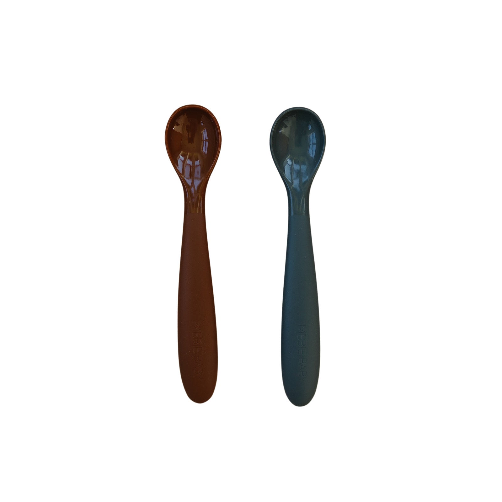 Two wooden spoons, one brown and one blue, on a white background.