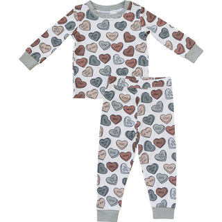 Children's pajama set with heart pattern on a white background