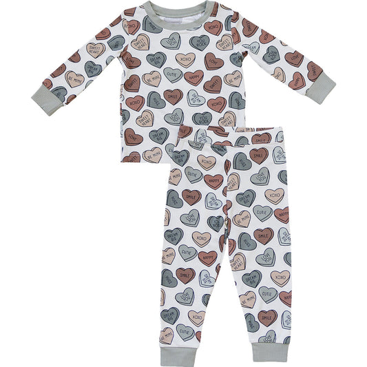 Children's pajama set with heart pattern on a white background