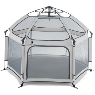 Portable playpen with mesh sides on a black background