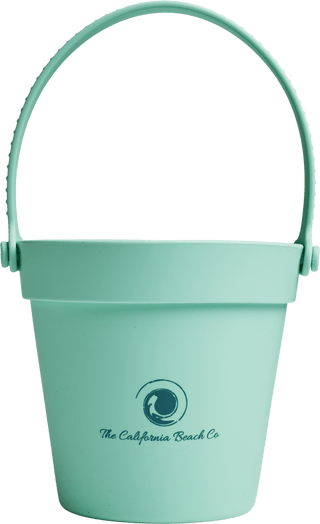 Light blue sand pail with handle on a transparent background