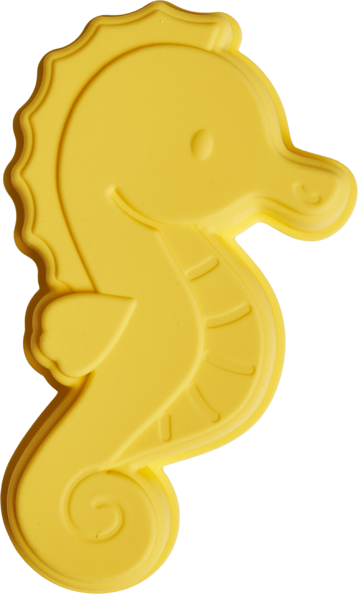 Yellow seahorse-shaped cookie cutter on a green background