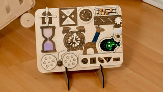 Wooden toy with various shapes and patterns on a wooden floor