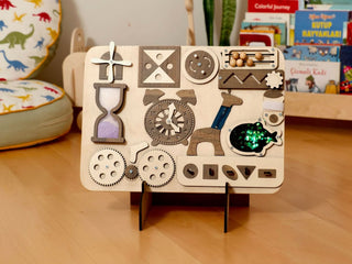 Wooden puzzle toy with various shapes and patterns on a wooden surface