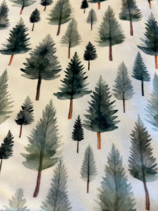 Pattern of watercolor trees on a light background