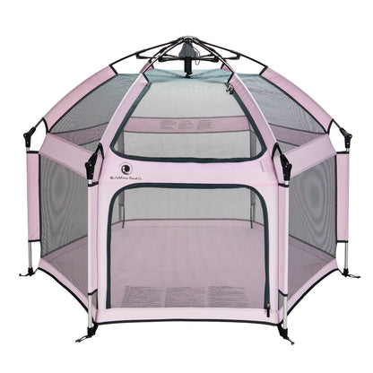 Pink pet playpen with mesh sides on a white background