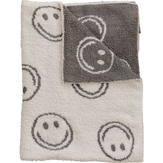 Blanket with smiley face pattern on a white background