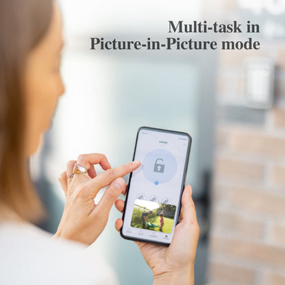 Person using a smartphone with Picture-in-Picture mode displayed on the screen.