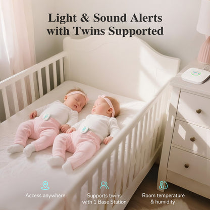 Two babies in a crib with a baby monitor displaying light and sound alerts feature.