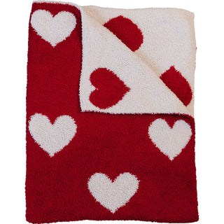 Red and white heart-patterned rug on a white background